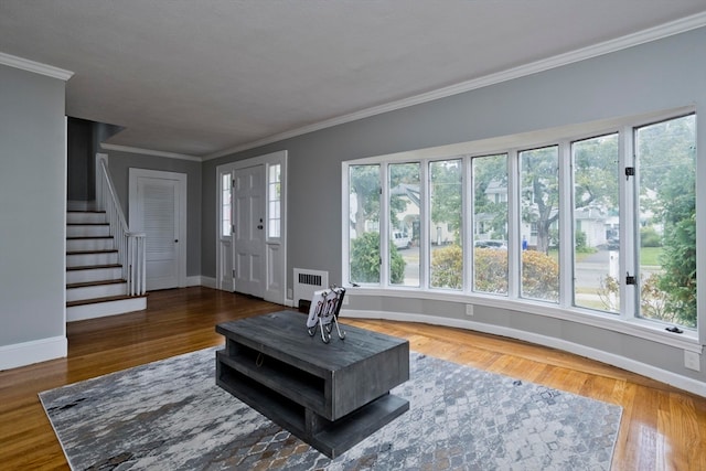 interior space with crown molding, dark hardwood / wood-style floors, and radiator heating unit