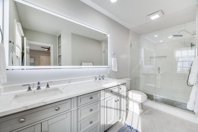 7 Colonial Dr, Chatham, MA 02633 - bathroom featuring toilet, double vanity, a shower stall, and tile patterned flooring