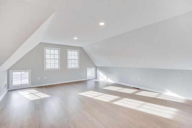 7 Colonial Dr, Chatham, MA 02633 - bonus room with wood finished floors, baseboards, lofted ceiling, and recessed lighting