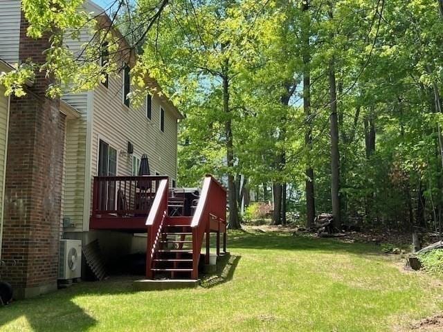 10 Atherton Rd, Hudson, MA 01749 - view of green lawn featuring stairway, a wooden deck, and a cooling unit