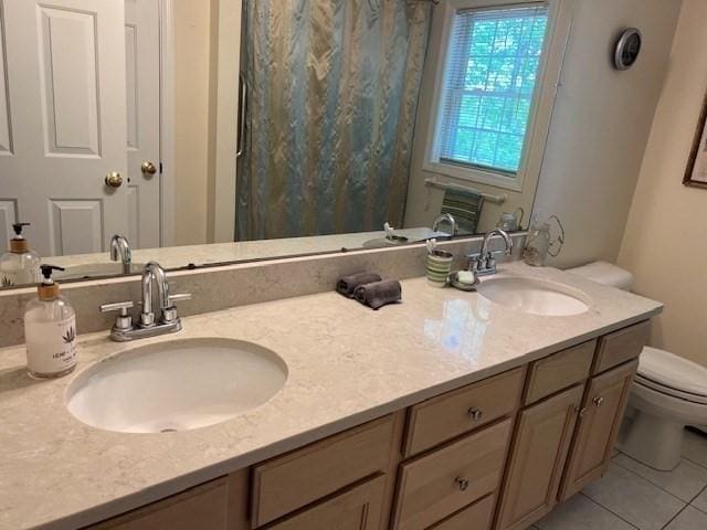 10 Atherton Rd, Hudson, MA 01749 - full bath with toilet, double vanity, and tile patterned flooring