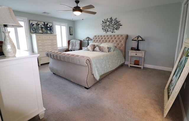 bedroom featuring visible vents, baseboards, a ceiling fan, and carpet flooring