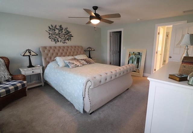 bedroom featuring visible vents, a ceiling fan, and carpet floors