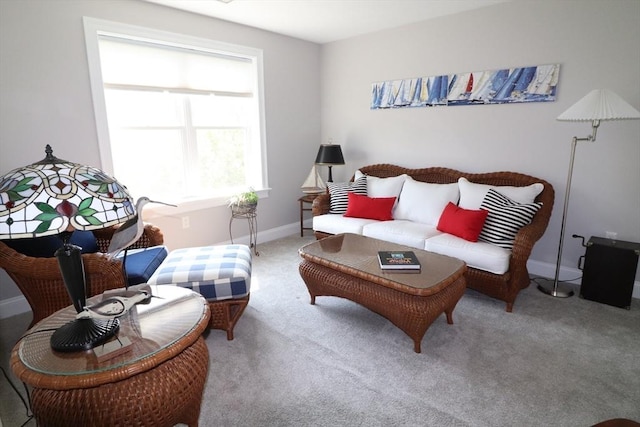 carpeted living room with baseboards