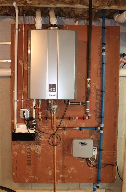 utility room featuring water heater