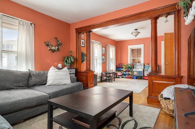 living room featuring decorative columns