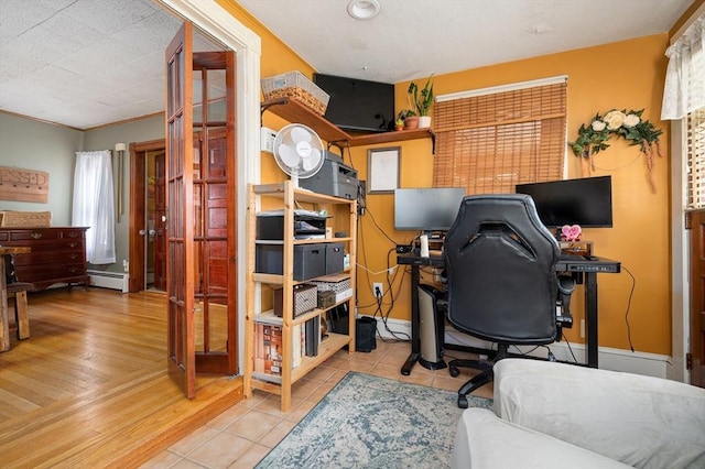 home office with tile patterned flooring and baseboard heating