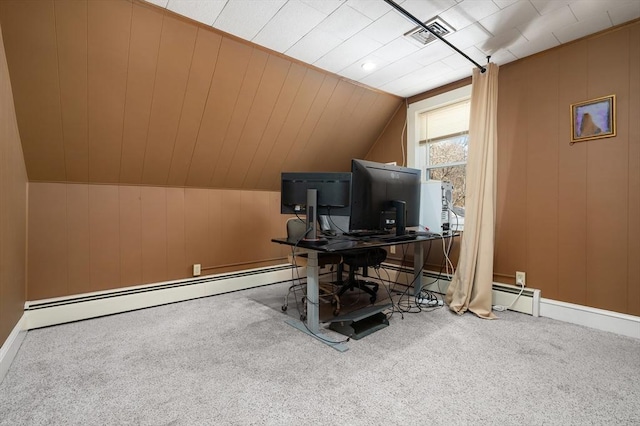 office area featuring wooden walls, carpet, lofted ceiling, and baseboard heating