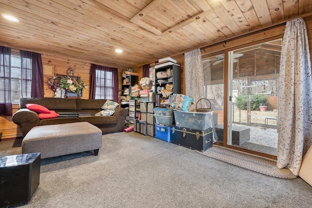 carpeted living area featuring recessed lighting, wood ceiling, and wood walls