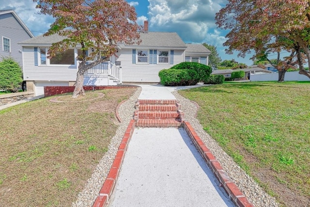 bungalow-style home with a front lawn