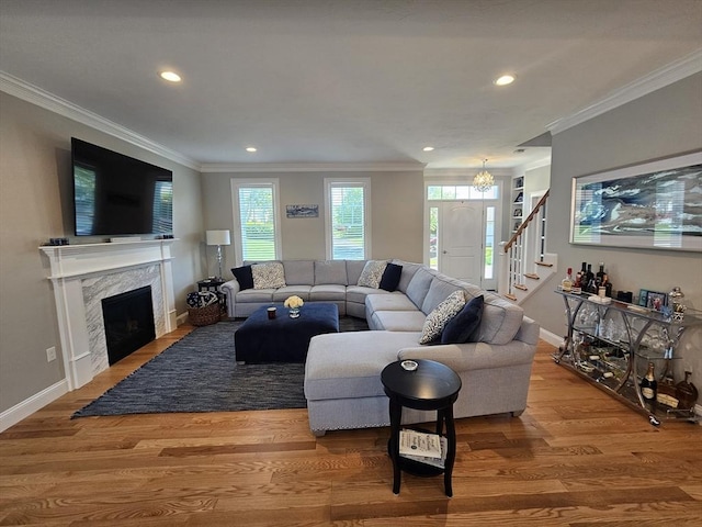 38 John Perkins Way, Middleboro, MA 02346 - living room with wood finished floors, recessed lighting, ornamental molding, a chandelier, and baseboards