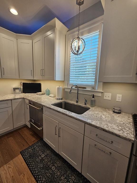38 John Perkins Way, Middleboro, MA 02346 - kitchen featuring a sink, dark wood-style flooring, hanging light fixtures, light stone counters, and a chandelier