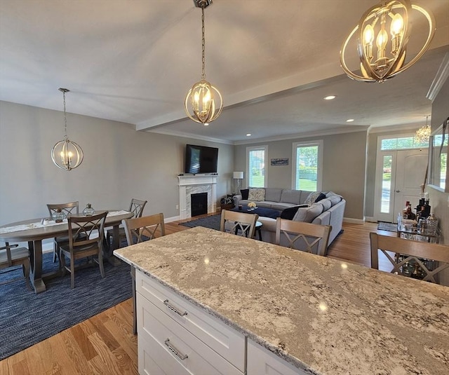 38 John Perkins Way, Middleboro, MA 02346 - kitchen with a chandelier, white cabinetry, light wood-style flooring, ornamental molding, and recessed lighting