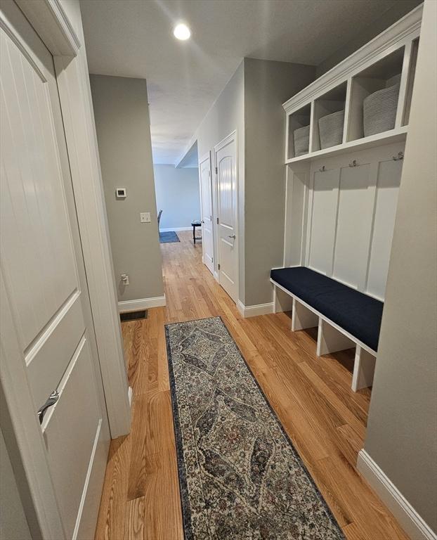 38 John Perkins Way, Middleboro, MA 02346 - mudroom with light wood finished floors and baseboards