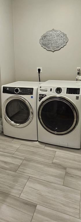 38 John Perkins Way, Middleboro, MA 02346 - laundry area featuring washing machine and clothes dryer