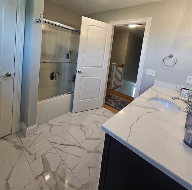 38 John Perkins Way, Middleboro, MA 02346 - bathroom featuring vanity, marble look tiles, enclosed tub / shower combo, and baseboards