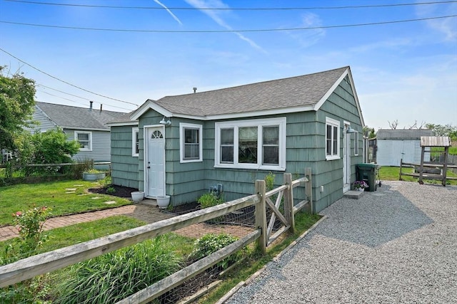 22 Mcarthur Ln, Marshfield, MA 02050 - view of front of home with a shingled roof and an outbuilding