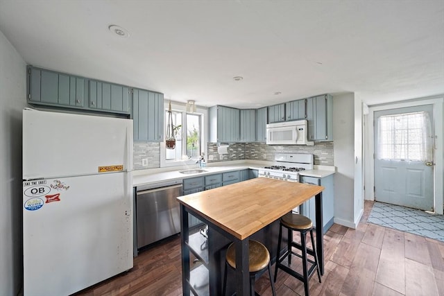 22 Mcarthur Ln, Marshfield, MA 02050 - kitchen with white appliances, light countertops, a sink, and dark wood-style flooring