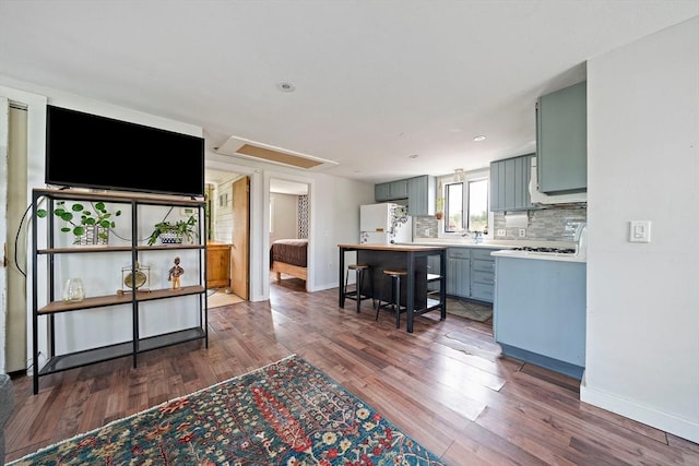 22 Mcarthur Ln, Marshfield, MA 02050 - kitchen with light countertops, dark wood-style floors, and baseboards