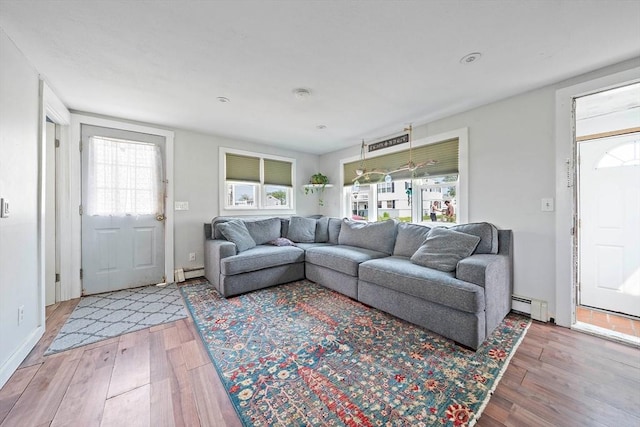22 Mcarthur Ln, Marshfield, MA 02050 - living room with light wood-style floors, baseboard heating, and baseboards