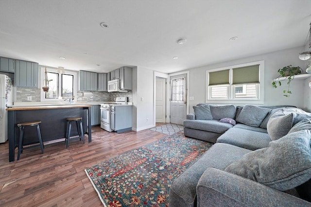 22 Mcarthur Ln, Marshfield, MA 02050 - living area featuring plenty of natural light, wood finished floors, and recessed lighting