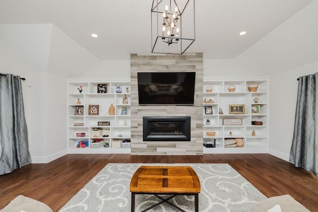 living area with lofted ceiling, baseboards, wood finished floors, and built in features