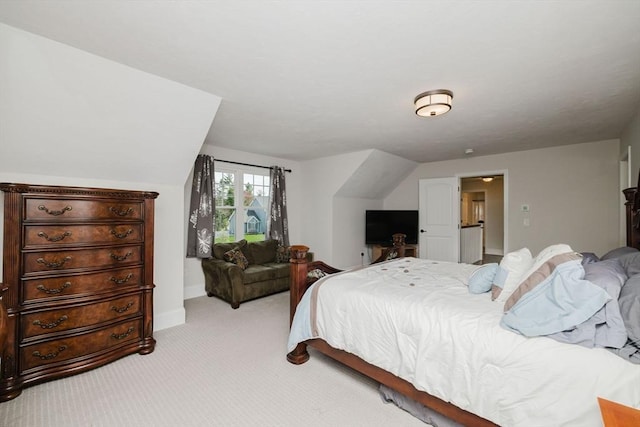 bedroom featuring baseboards and light colored carpet