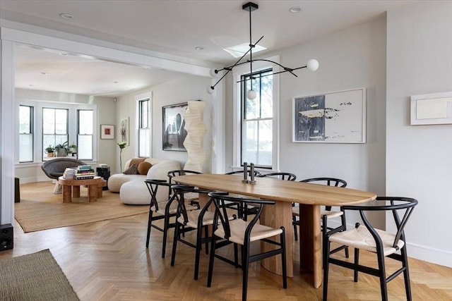 dining room with baseboards, recessed lighting, a chandelier, and beamed ceiling