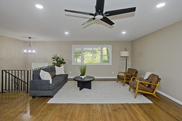 24 Old Jarvis Ave, Holyoke, MA 01040 - living area with baseboards, wood finished floors, a chandelier, recessed lighting, and a ceiling fan