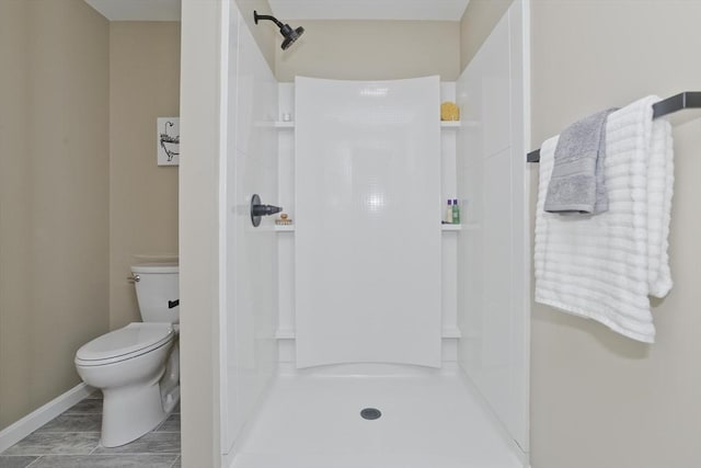24 Old Jarvis Ave, Holyoke, MA 01040 - full bathroom featuring a shower, toilet, and baseboards