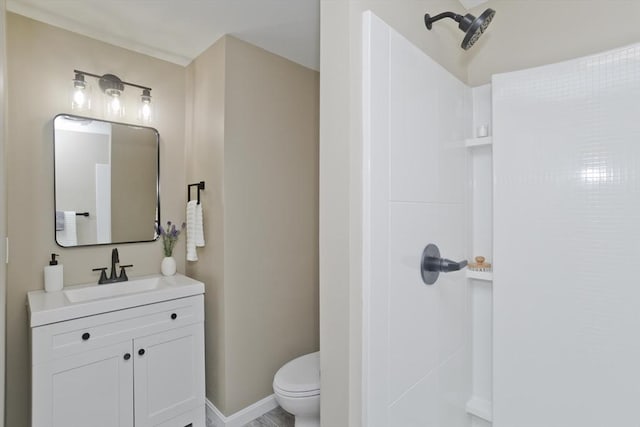 24 Old Jarvis Ave, Holyoke, MA 01040 - bathroom with toilet, vanity, a shower, and baseboards