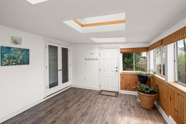 sunroom with a skylight and french doors