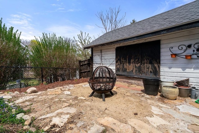 view of patio with fence and an outdoor fire pit
