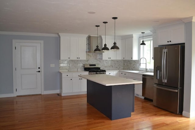 28 Barrows St, Norton, MA 02766 - kitchen featuring stainless steel appliances, wall chimney range hood, white cabinetry, and ornamental molding