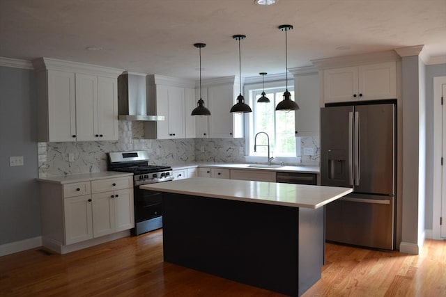 28 Barrows St, Norton, MA 02766 - kitchen featuring stainless steel appliances, wall chimney range hood, white cabinets, light wood-type flooring, and light countertops