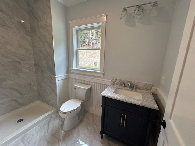 bathroom featuring vanity, a shower, and toilet