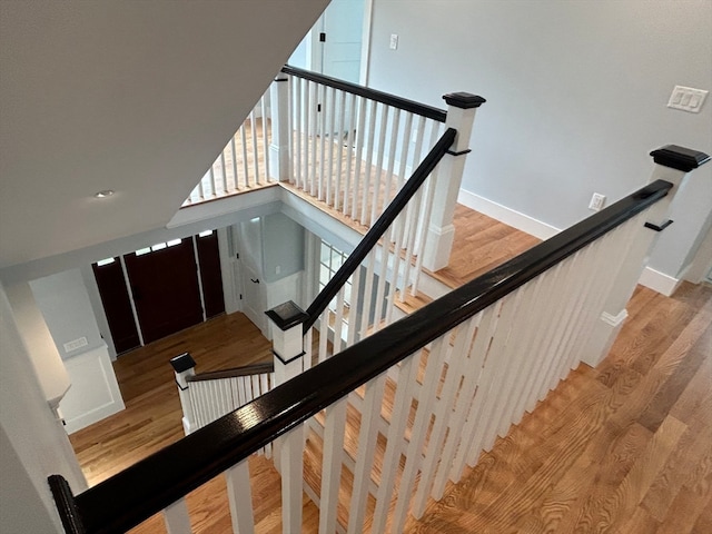 staircase featuring wood-type flooring