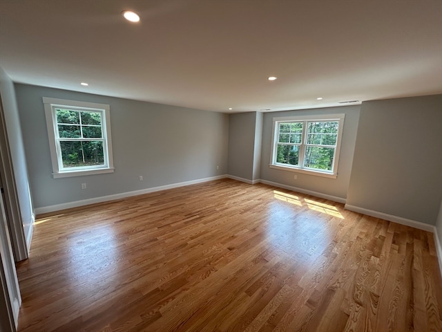 unfurnished room featuring light hardwood / wood-style floors