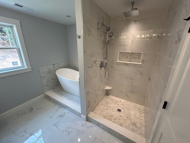 bathroom with shower with separate bathtub