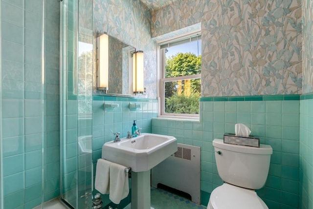 22 Adams Ave, Watertown, MA 02472 - full bath with a shower stall, wallpapered walls, a wainscoted wall, toilet, and radiator heating unit