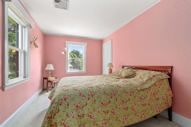 22 Adams Ave, Watertown, MA 02472 - bedroom with visible vents, baseboards, wallpapered walls, crown molding, and light colored carpet