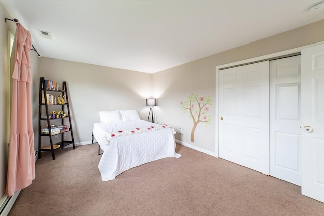 bedroom with carpet flooring, a closet, and baseboards