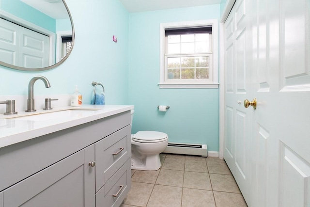 bathroom with a baseboard radiator, toilet, tile patterned floors, vanity, and baseboards