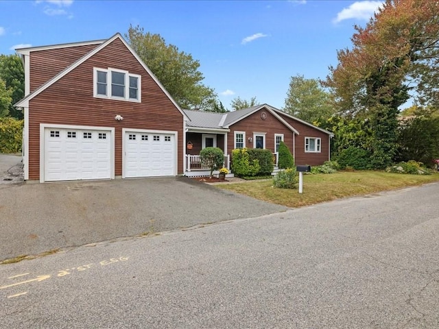 view of front of house featuring a front yard and a garage