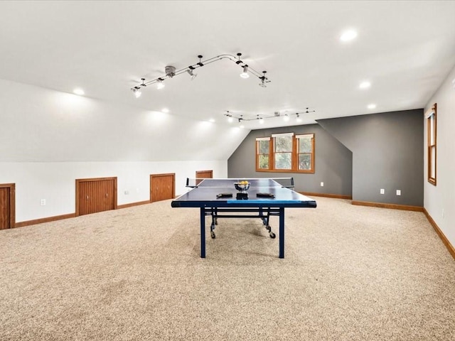 recreation room with carpet and lofted ceiling