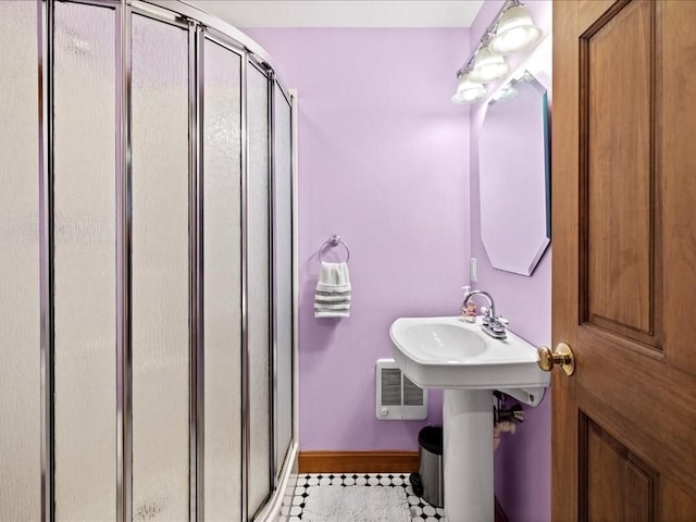 bathroom featuring an enclosed shower