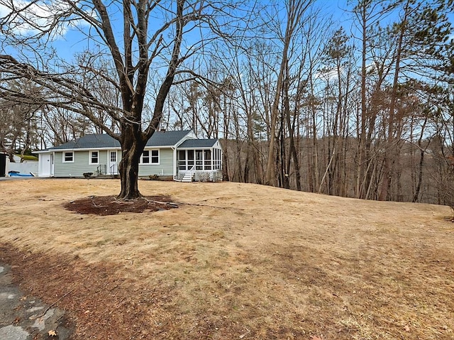 view of yard featuring a sunroom