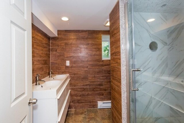 bathroom with vanity and a shower with shower door