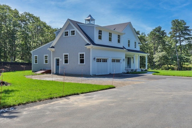 exterior space featuring a garage and a front yard