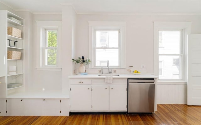 kitchen with dishwasher, a sink, open shelves, wood finished floors, and white cabinetry